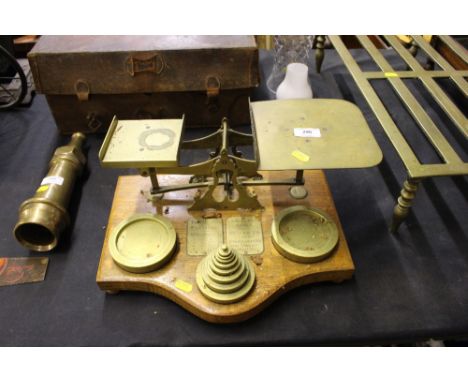 A large set of Victorian oak and brass postal scales and weights