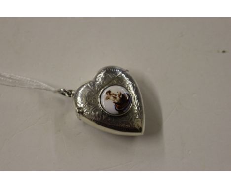 A white metal and enamel decorated heart shaped vesta case 