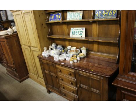 An Ercol dresser fitted four short drawers 