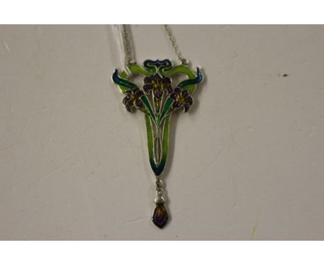 A white metal and enamel decorated Art Nouveau design pendant and chain 