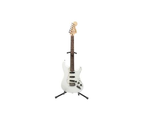 A Squier Stratocaster, made in Indonesia, with maple/rosewood neck, Duncan design Hotrail pickups, white finish, Stagg moulde
