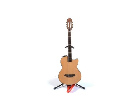 A Stagg nylon-strung solid-bodied guitar, with spruce capped hardwood body, single cutaway, slotted headstock, fitted with an