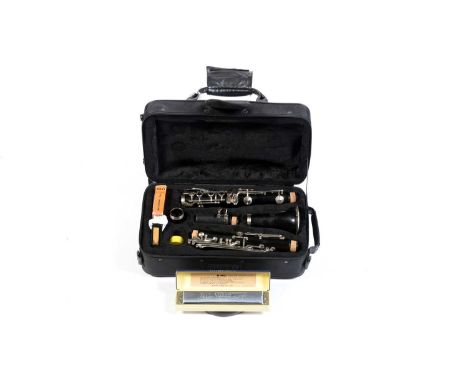 A J Michael student Bb clarinet, serial number CH07151, cased; and a Yamaha No-24 Virtuoso tremolo harmonica, boxed. (2)