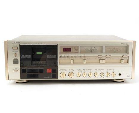 A Luxman K-04 manual-calibration cassette deck, with silver brushed-aluminium facia.