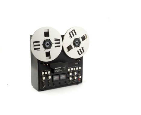A Tandberg TD20A SE reel-to-reel tape deck; together with ten Maxell audio tapes, a Ferrograph audio tape; and a Ferrograph m