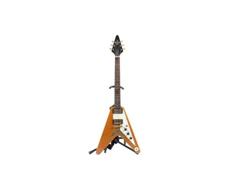 An Epiphone by Gibson Flying V guitar with set maple neck, gold hardware and vintage style tuners, Stagg soft case.