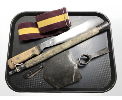 A British military issue machete, stamped Elwell 1965, together with a folding knife, an entrenching tool head, a further woo