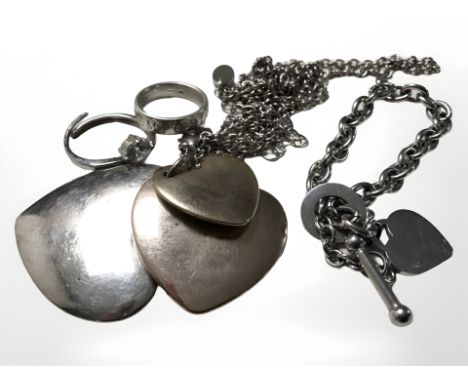 A costume pendant strung with three graduated hearts, a dress ring, a band ring signed Armami and a replica Tiffany bracelet.
