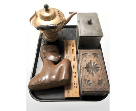 A brass spirit kettle on burner stand, African hardwood bust, cribbage board, carved miniature blanket box and a EPNS two-div