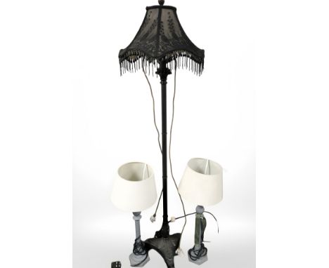 A contemporary patinated metal standard lamp and a pair of table lamps.