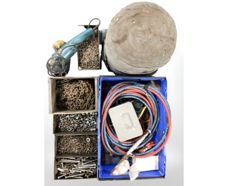 A disc grinder, lengths of steel chain, assorted nuts and bolts, welding torch, large roll of steel wool, etc. 