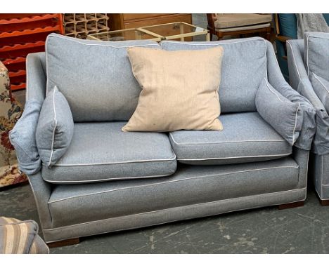 A modern two seater sofa, with cream piping, 140cmW 