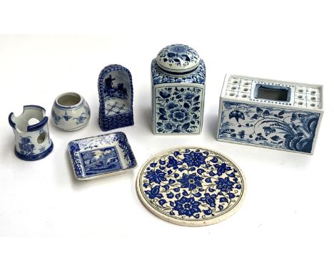 A Delft tea caddy, together with a Mottahedeh flower arranging brick, 15.5cmW, Delft candle holder, Iznik style round tile pa