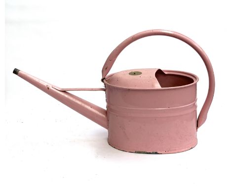 A Haws pink enamel watering can
