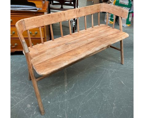 A 20th century stick back bench, with curved rail over a three plank seat, legs joined by H stretcher, approx. 132cmW 