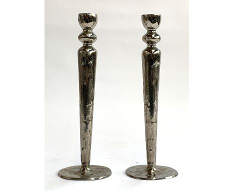 A pair of heavy metal candlestick holders, 29.5cmH 