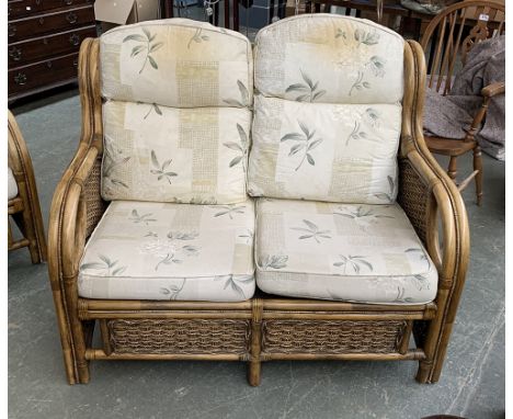 A bamboo conservatory sofa with cushions, 123cmW; together with a bamboo occasional table 