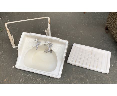 A white ceramic basin, with cast iron white enamel bracket, by Pontifex &amp; Sons Ltd, 60cmW; together with a ceramic draini
