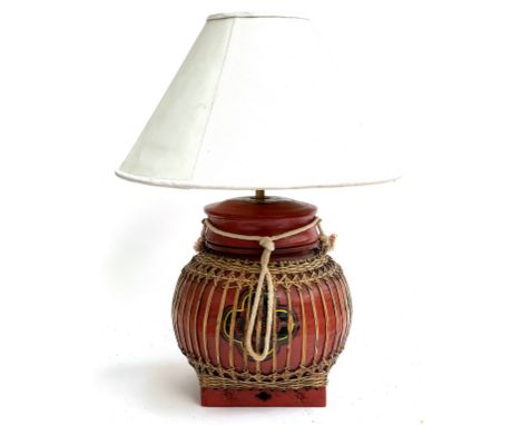 A Chinese red painted and cane table lamp, with white shade, 52cmH to top of shade 