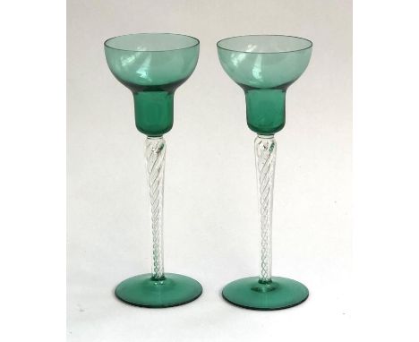 A pair of green glass and spiral airtwist stemmed candlestick holders, 21cmH 