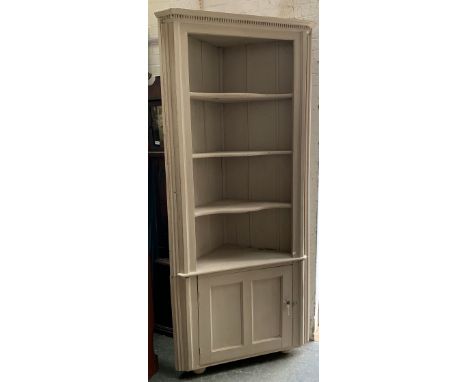 A tall grey painted pine standing corner cupboard, three shelves over a panelled door, 100cmW  226cmH 