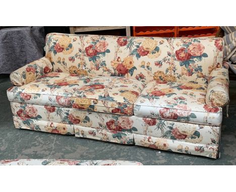 A country house three seater sofa, upholstered in floral fabric, 195cmW with matching footstool 