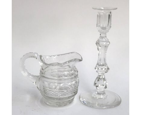 A small 19th century cut glass jug, 11cmH; together with a 19th century cut glass candlestick on spreading circular foot, 21.