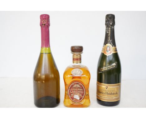 Bottle of single malt Cardhu scotch whisky together with 2 bottles of champagne 