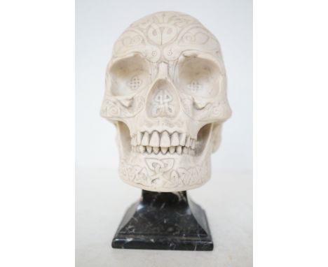 Day of the dead Mexican sugar skull sculpture in the type of faux stone signed on a marble base Height 21 cm Approx. 5kg 