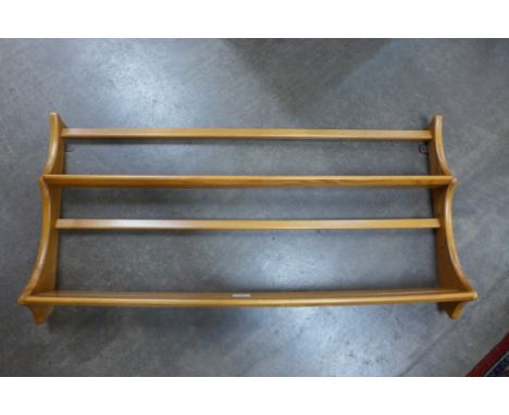 An Ercol Blonde ash wall rack 