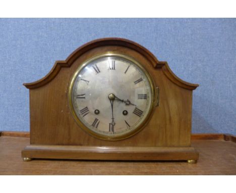 A mahogany mantel clock and an oak wall clock 