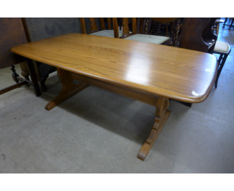 An Ercol Golden Dawn elm and beech coffee table 
