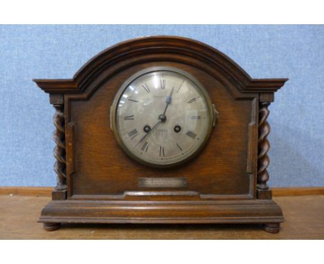 A Mappin &amp; Webb oak barleytwist mantel clock 