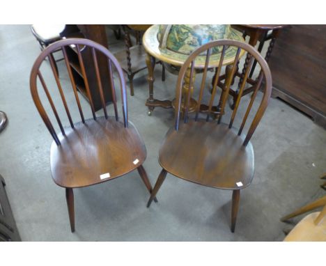 A pair of Ercol Golden Dawn elm and beech Windsor chairs 