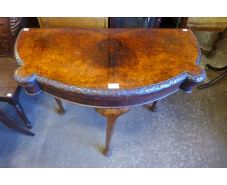A George I style burr walnut fold over card table 