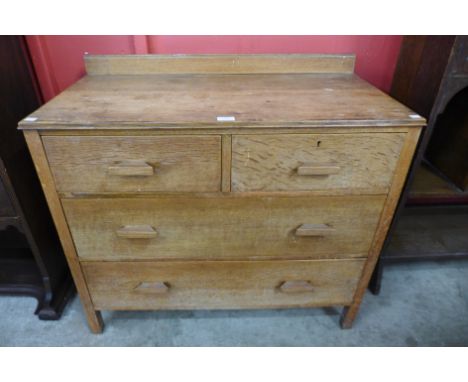 An Art Deco light oak chest of drawers 