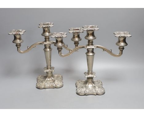 A pair of two branch, three light plated candelabra - 26cm high