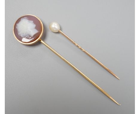 An early 20th century yellow metal and sardonyx cameo set stick pin, carved with the head of a lady to sinister, 79mm and one