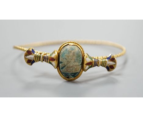 A 19th century yellow metal, polychrome enamel and scarab set hinged bangle, interior diameter 58mm, gross weight 11.7 grams.