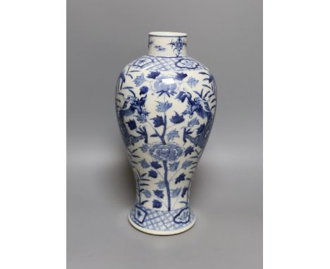 A Chinese blue and white ‘dragon’ vase. Kangxi mark but later, 31cm