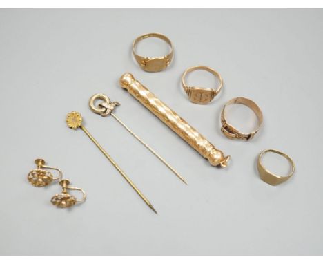 Four assorted 9ct rings including a Victorian buckle ring, 14 grams, two stick pins including part 15ct, a pair of yellow met