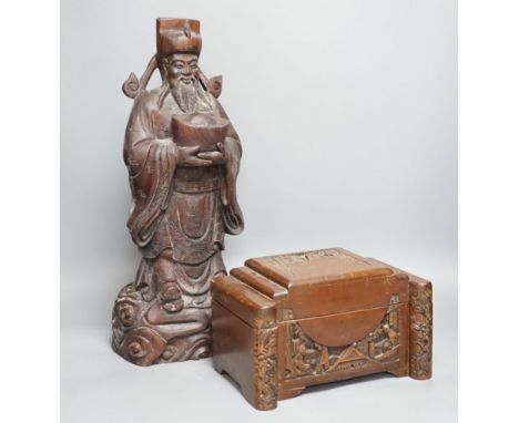 A Chinese carved wood sage and small carved trunk,Sage 47 cms high.