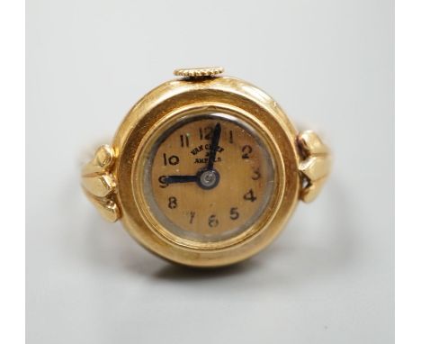 A yellow metal ring watch, the dial inscribed 'Van Cleef &amp; Arpels', size N/O, gross 8.2 grams.