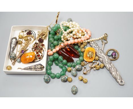 A group of assorted Victorian and later jewellery, including a gold and gem set ring, a pair of gilt metal drop earrings, a p