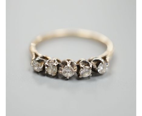 A yellow metal and five stone diamond set half hoop ring, size M, gross weight 1.6 grams.