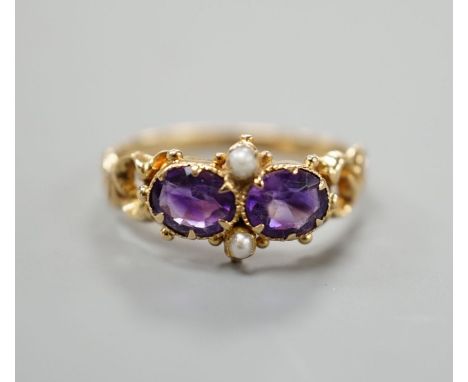 A late Victorian yellow metal, two stone amethyst and two stone seed pearl set cluster ring, size L, gross weight 2.1 grams.