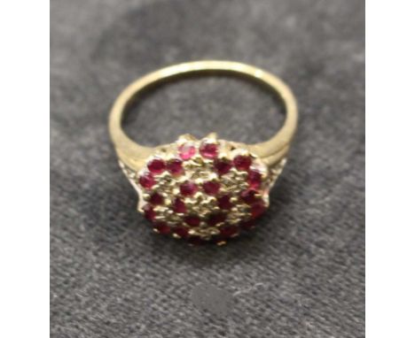 9ct Gold Ruby and Diamond Cluster ring. 4.3 grams.
Consists of twelve approx 0.01cts round brillaint diamonds and twenty four