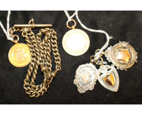 Two 9ct Gold '375' hallmarked Prize Medals. One of the medals come with a Rolled Gold Albert Chain and three Sterling Silver 