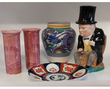 A Wade seated Winston Churchill lidded Toby jug , with blue bow tie and signature cigar in hand. 
A 1930's&nbsp; Carter Stabl