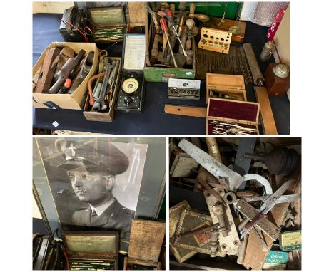 A framed photograph or&nbsp;&nbsp;LT COL Woosnam&nbsp; a selection of electrical testing meters, A roll of drill bits, Balanc